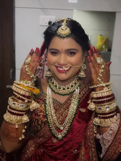 A happy bride showing off her complete look. The smile on her face is the best testament to how confident and beautiful she feels.