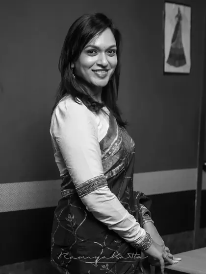 A portrait of myself, Ramya Katta, in my creative space. It is my passion to weave stories into fabric and create timeless pieces for your most special moments.