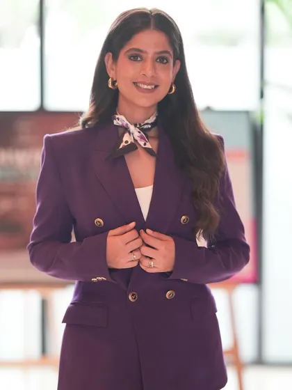 A close-up of my professional look for the Shiprocket summit. The purple pantsuit felt bold and confident, perfect for a leadership event.