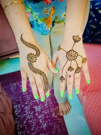 Two different simple mehandi designs. One is a leafy trail, and the other is a central mandala with connected finger designs, perfect for party guests.