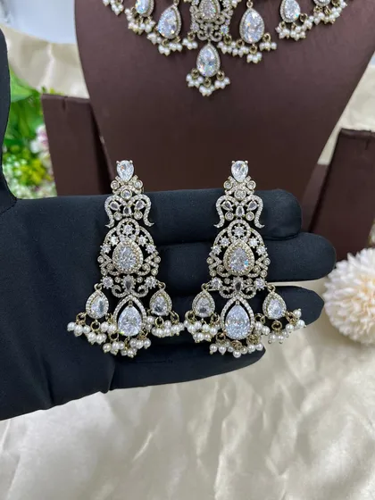 A close-up of the earrings from the white AD zircon choker set.