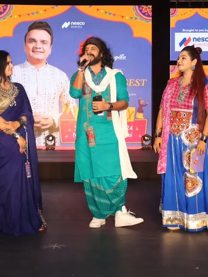 On stage with guest artists, showcasing my interactive and collaborative hosting style.