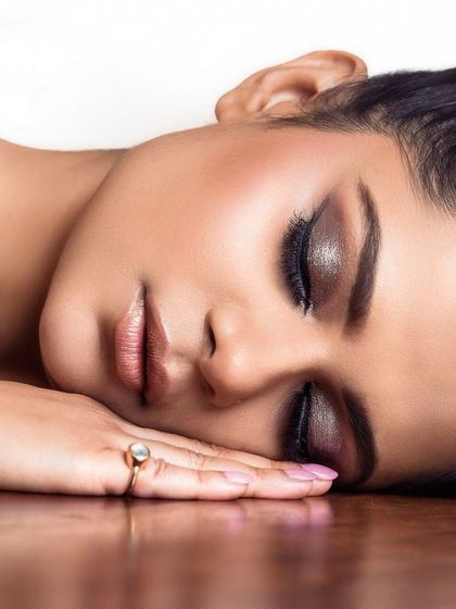 An artistic beauty shot with a serene, peaceful expression. This style of portrait can be used for skincare campaigns or editorials focused on natural beauty.