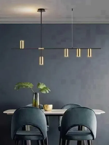 This minimalist black and gold LED chandelier offers a sophisticated lighting solution for modern dining rooms or kitchen islands. The adjustable cylindrical lights allow you to direct focus where it's needed, combining sleek design with practical function.