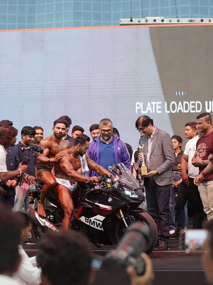 Surrounded by organizers and fellow athletes after the win.