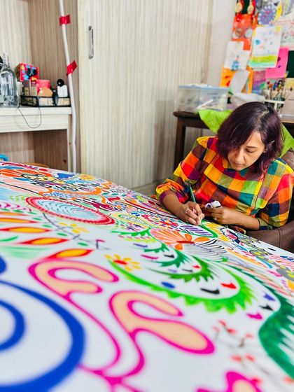 A close-up of me adding fine details with a marker. This is the stage where the painting's personality really starts to emerge.