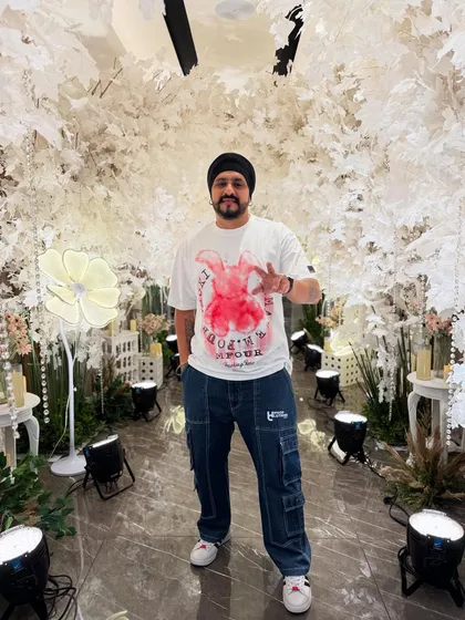 In front of a gorgeous white-themed decor setup for a reception gig. Ready for music until 3 AM.