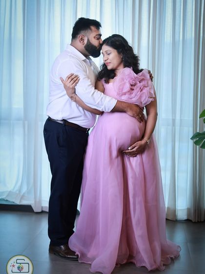 Our lavender organza gown is pure romance. It features a large, handcrafted statement flower on the shoulder and a light, airy skirt that flows beautifully.