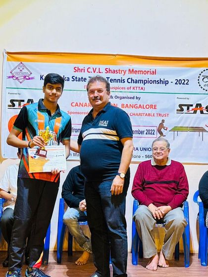 Samyak receiving his trophy for being the Runner-Up in the Men's Singles at the State Championship.