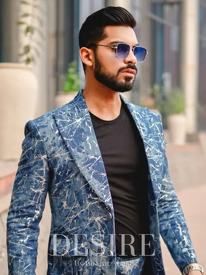 A powerful portrait in the blue splatter-print blazer. Paired with a simple black tee, the blazer becomes the undeniable centerpiece of the outfit.