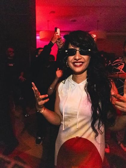 A guest enjoying the music, fully immersed in the party atmosphere. Our events are about creating moments of pure joy and freedom for everyone who attends.