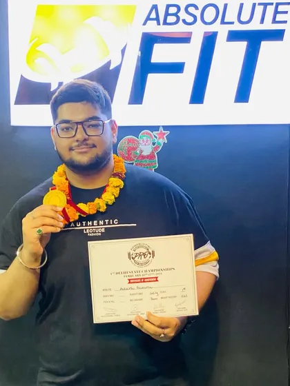 Another one of our champions celebrating his victory. This member's success in his powerlifting competition is a result of his hard work and the supportive training environment we provide.