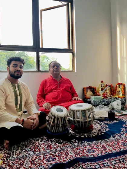 Seated beside my Guru with our tablas after the Guru Purnima ceremony.
