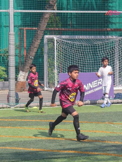 Action from a DPDL match, with our young player focused on the game in front of the goal.