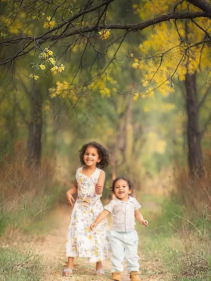 We love capturing the pure, unfiltered joy of childhood. This outdoor session in a beautiful wooded area was all about letting these siblings run, play, and just be kids, resulting in authentic, story-filled photographs.