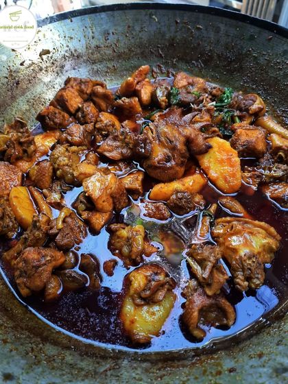 A pot of my country chicken (Kuroiler) gravy, rich and full of authentic flavor.