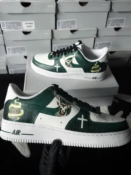 The inner side of the Jägermeister custom sneakers. This view shows the continuation of the design, featuring the brand's iconic stag and cross emblem, ensuring a complete 360-degree artwork.