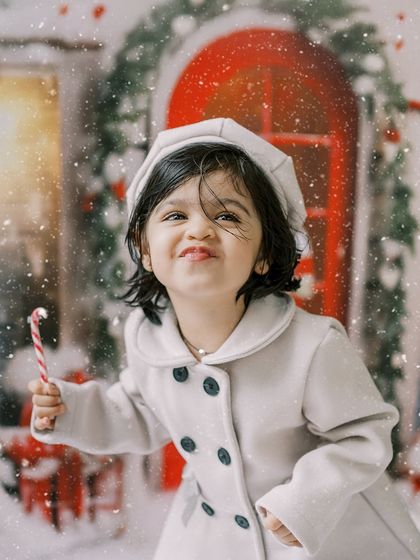 A little girl making a funny face with her candy cane. These personality-filled shots are always a favorite.