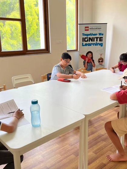 Our classroom during the IRO entrance test, with students focused on their papers. We create a structured environment to help them perform their best.