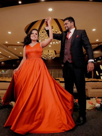 A joyful shot of the couple during their first dance. The bride's flowing dress and their happy expressions make this a dynamic and beautiful image.