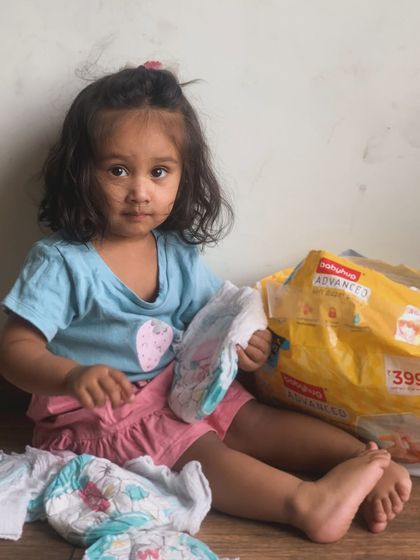 A candid moment during a diaper change. Using quality diapers like Babyhug Advanced makes these daily routines much smoother.