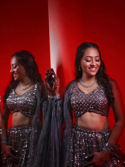 A creative shot of the sangeet bride, her reflection showing another angle of her glam look.