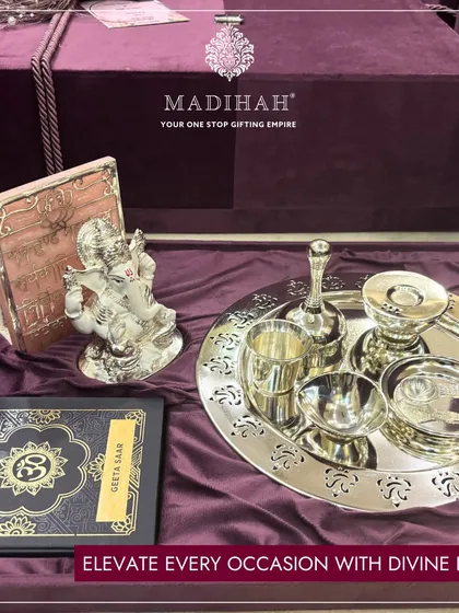 Sacred moments deserve timeless elegance. This Pooja Thali set is designed to bring a sense of divinity and grace to your home rituals. The set includes a finely crafted silver-plated thali, a Ganesha idol for blessed beginnings, and all the essential accessories, presented in a luxurious keepsake box.
