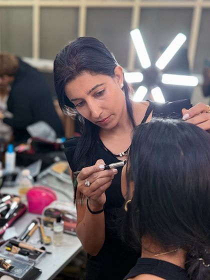 My talented team at work during the NIFT fashion show. It takes a coordinated effort to get all the models ready, and they always do an amazing job.