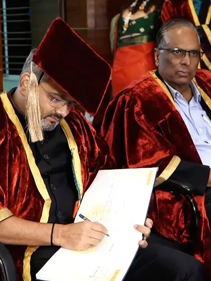 Signing the visitor's book at Sri Krishna Degree College after the ceremony. It was a well-organized event that truly celebrated the students.