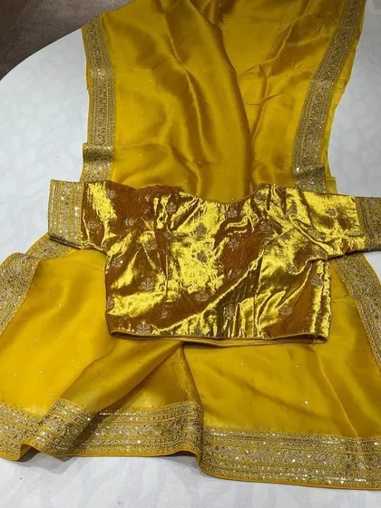 A look at my Sabyasachi-inspired collection. These sets feature pure organza sarees with detailed borders, paired with luxurious velvet designer blouses. They are available in a range of beautiful colors like brown, navy, green, black, yellow, purple, and off-white.