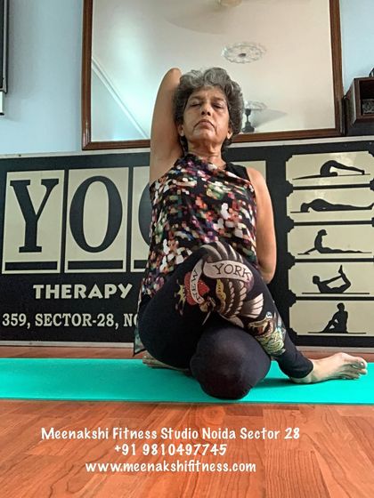 Gomukhasana, or Cow Face Pose. This seated posture provides a deep stretch for the shoulders, chest, and hips.