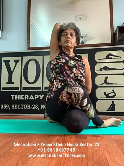 Gomukhasana, or Cow Face Pose. This seated posture provides a deep stretch for the shoulders, chest, and hips.