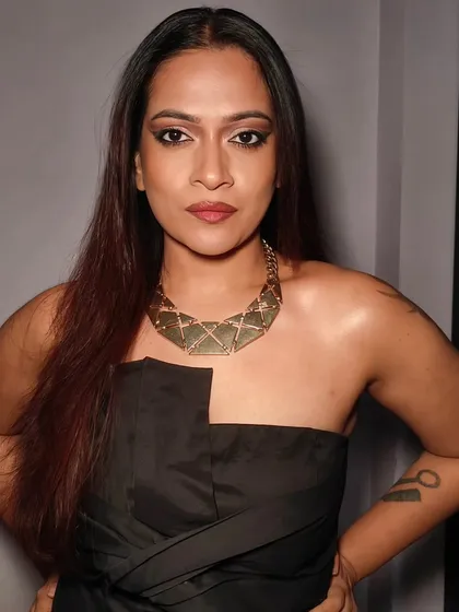This is a selfie showing a bold and confident makeup look. I've paired a strong, smokey cat-eye with a defined brow and a warm-toned lip, perfect for a night out.