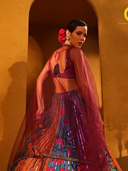 A closer view of this multi-colored masterpiece. The combination of floral prints and shimmering sequins creates a rich texture and a truly unforgettable look.