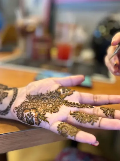 Another close-up of the process, showing the creation of fine lines and swirls.