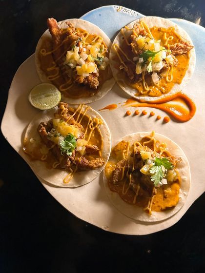 These Chipotle Chicken Tacos from Mestizo were divine. The composition of this photo is designed to be vibrant and dynamic, reflecting the bold flavors of the dish.
