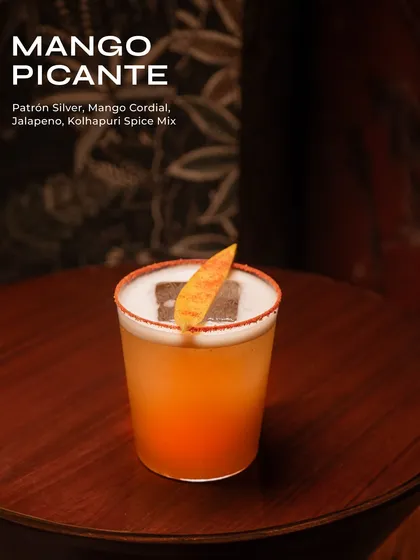 The Mango Picante, a perfect blend of sweet and spicy. This cocktail features Patrón Silver, mango cordial, jalapeño, and a Kolhapuri spice mix for an extra kick.