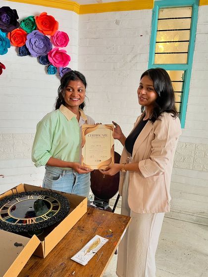 Another happy participant receives her certificate after completing a beautiful resin clock. Our workshops are a great way to build confidence and learn new skills.