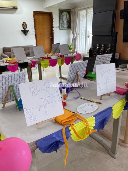 A peek at our flamingo paint party setup, ready for the little artists to arrive. Each station includes a pre-drawn canvas, an easel, a paint palette, and brushes.