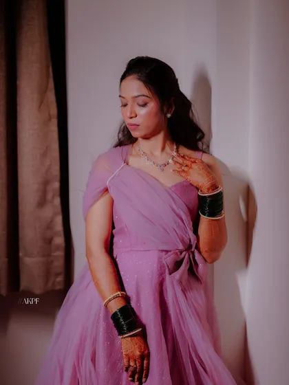 A soft and ethereal look for a Sangeet night. The bride's lavender gown is paired with delicate makeup and simple, elegant jewellery.