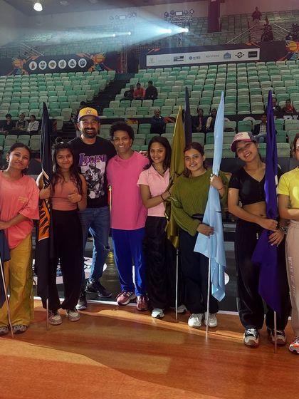 My flag-bearing performers posing before the INBL show. We manage all aspects of a performance, including props and costumes, to fit your event's theme.