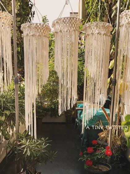 A collection of my long boho chandeliers, drying in the sun. Each one is handmade and can be customized in size and color to fit your personal style and space.