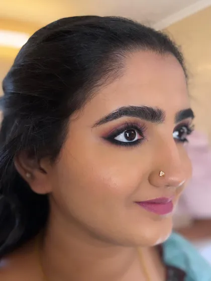 My bride Hema opted for a simple matte kohl-rimmed eye and pink nude lips for her reception. It's a classic, pretty look that never goes out of style.