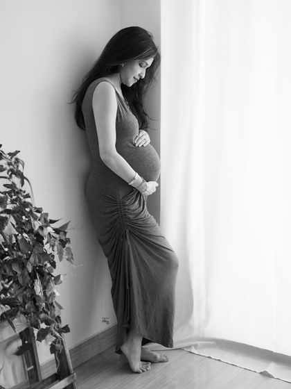 Another angle from this serene window-lit session. This black and white shot feels intimate and peaceful, a quiet moment captured forever.