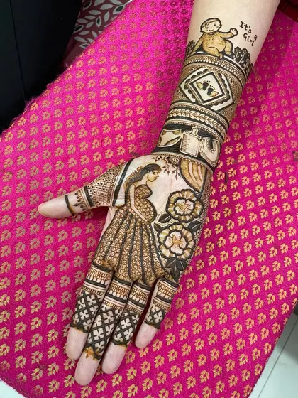 A sweet and personal baby shower mehendi. This design features a portrait of the mother-to-be and the announcement "It's a Girl" at the top.