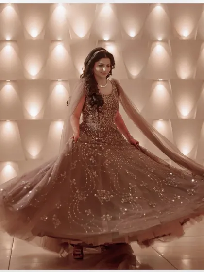 A beautiful twirling shot of the bride, Kirti, her sequined gown catching the light perfectly.