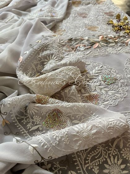 A close-up of the dupatta, highlighting the delicate floral motifs and beadwork.