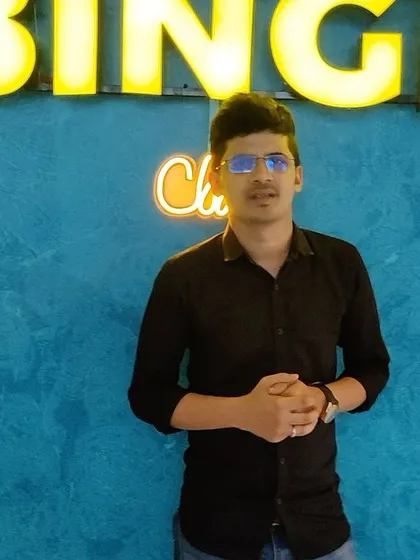 Another satisfied customer at Binge Club! The vibrant blue wall and our glowing logo make for a great photo opportunity before or after your private movie session.