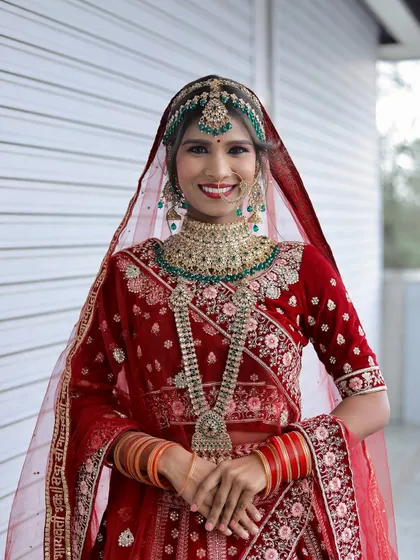 A smiling portrait of the bride, showcasing the student's ability to create makeup that looks stunning and feels comfortable.