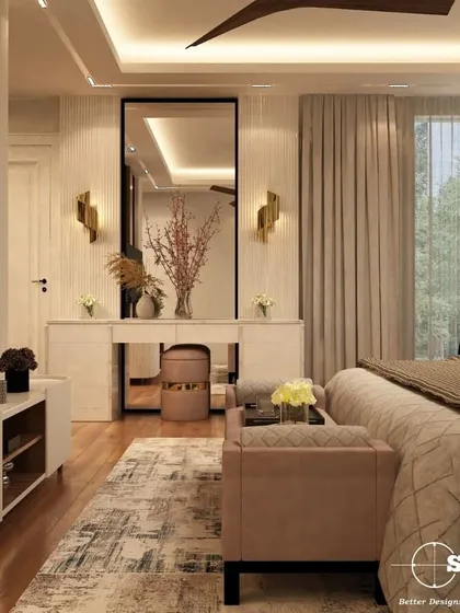 A master bedroom designed as a tranquil sanctuary. This space features a neutral color palette, a custom upholstered bed, and a sleek dressing unit with integrated lighting. The focus is on creating a calm, uncluttered environment that promotes rest and relaxation.
